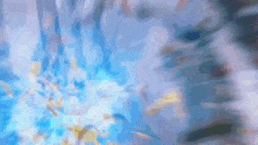 a blurry picture of a blue background with a few white spots