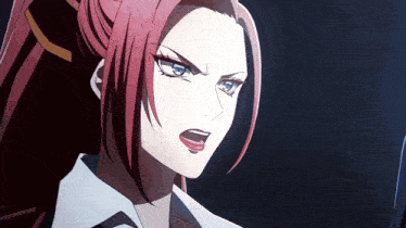 a girl with red hair and blue eyes looks angry