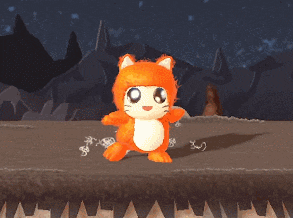 a stuffed animal in a cat costume is standing on a rocky surface