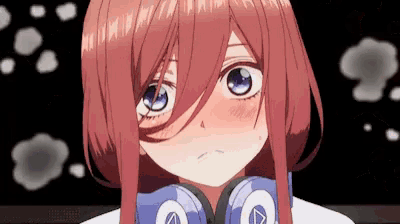 a close up of a girl wearing headphones with a letter a on them