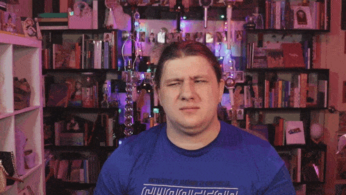 a man wearing a blue shirt that says ' independence is a rarity in america '