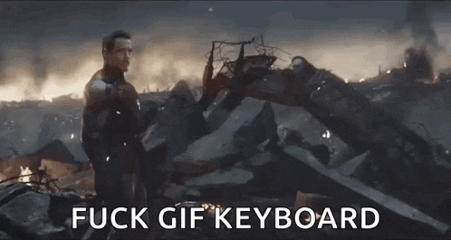 a man standing in front of a pile of rubble with the words fuck gif keyboard