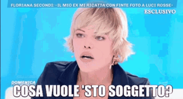 a woman with short blonde hair says " cosa vuole sto soggeto "