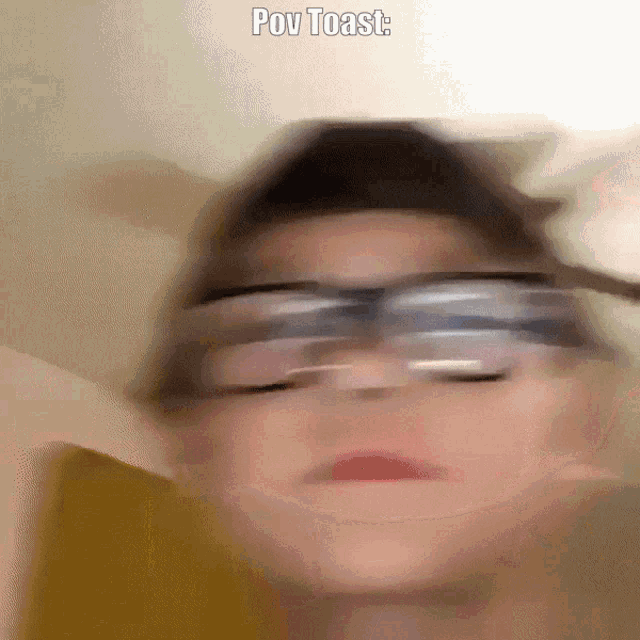 a blurry picture of a person 's face with the words pov toast above it