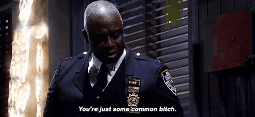 a man in a police uniform is talking to another man and says `` you 're just some common bitch '' .