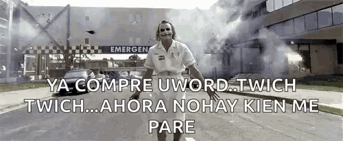 a joker is standing in front of an emergency room