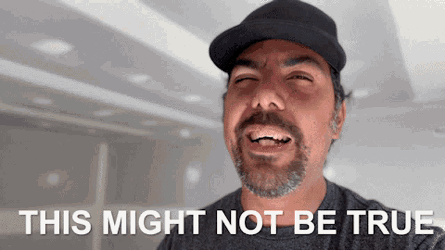 a man with a beard is making a face with the words this might not be true below him
