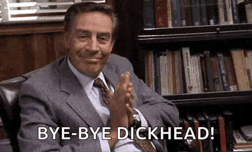 a man in a suit and tie is clapping and saying bye bye dickhead