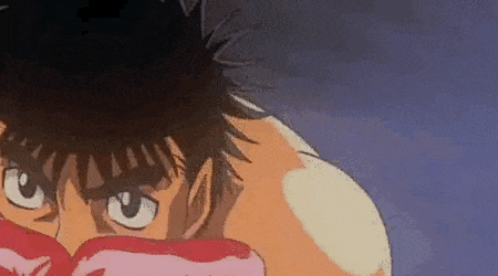 a close up of a cartoon character with boxing gloves on his face .
