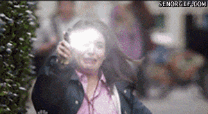 a woman talking on a cell phone with a senorgif.com watermark on the bottom
