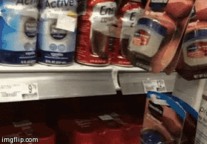 several cans of emeril active are on a shelf