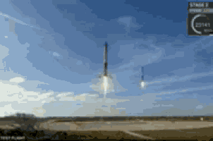 two rockets are flying in the sky with a sign that says stage 1 on it
