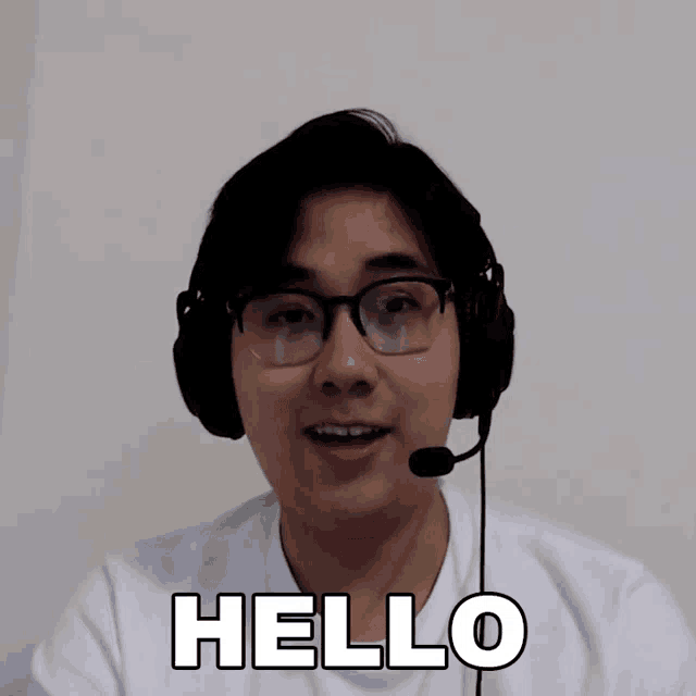 a man wearing headphones and a microphone is saying hello
