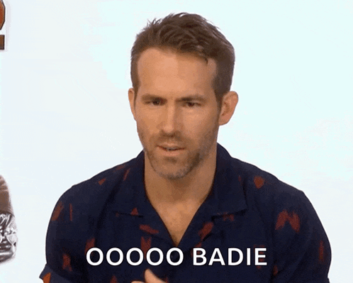 a man wearing a blue shirt says oooo badie