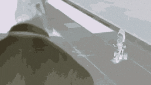 a person is riding a bike on a sidewalk .