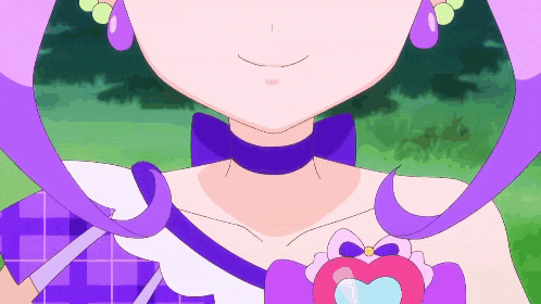 a close up of a girl with purple hair and a heart shaped pendant