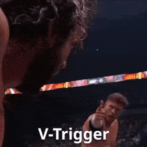 a blurry picture of a person holding a gun with the words v-trigger written on it .