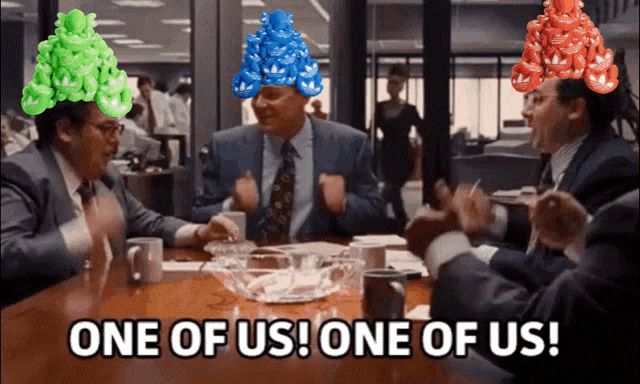 a group of men sitting at a table with one of them saying one of us one of us