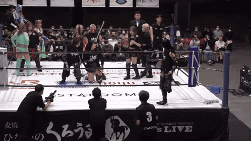 a wrestling ring with a sign that says s live on it