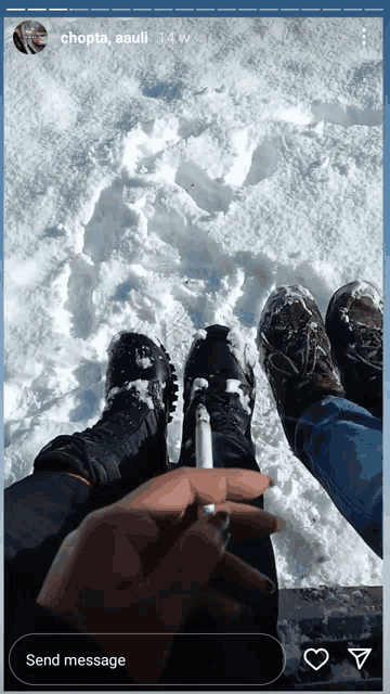 a person smoking a cigarette in the snow with chopta aauli written on the bottom right