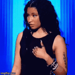 a woman in a black dress is giving a thumbs up .