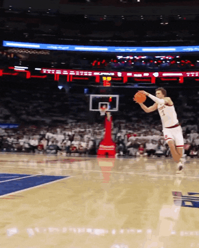 a basketball player with the number 1 on his jersey jumps to catch the ball