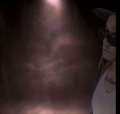 a man wearing a hat and sunglasses has a tattoo on his chest that says la pasion