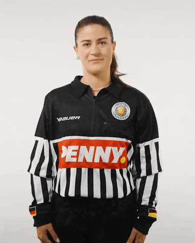 a woman wearing a black and white jersey with penny on the front