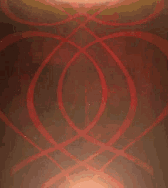 a red symbol in a circle with a light coming out of it .