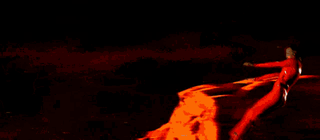 a man in a space suit stands next to a woman on a red planet