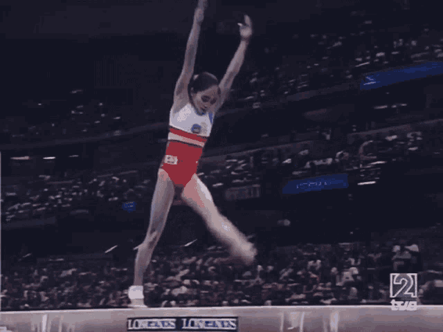 a gymnast on a balance beam with longines on it