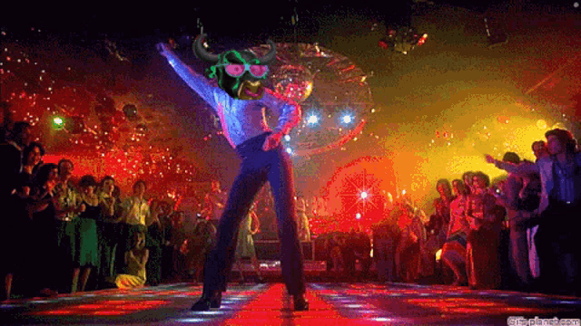 a man in a bull mask is dancing in a disco club