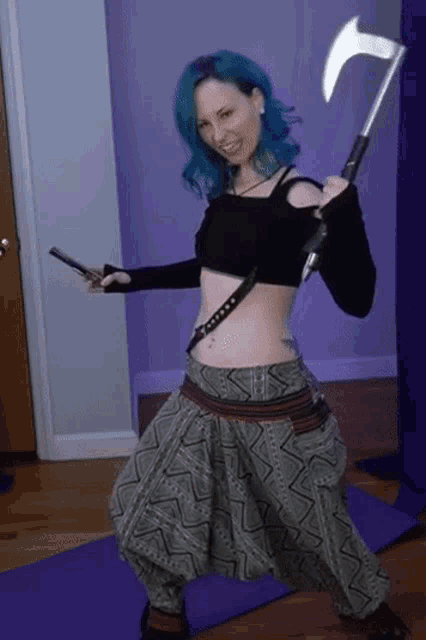 a woman with blue hair is holding an axe and a gun