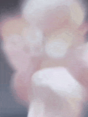 a close up of a pink and white ice cream cone