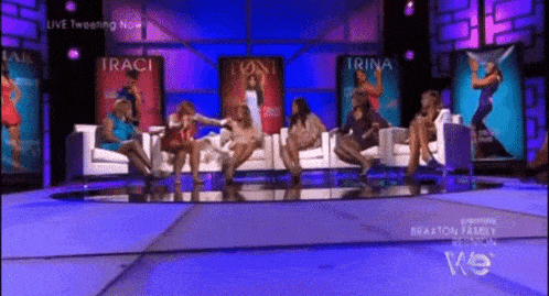 a group of women are sitting on a couch in front of a screen that says traci