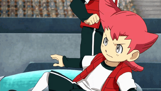 a cartoon character with pink hair is sitting on a table with a tv screen behind him that says tv tokyo