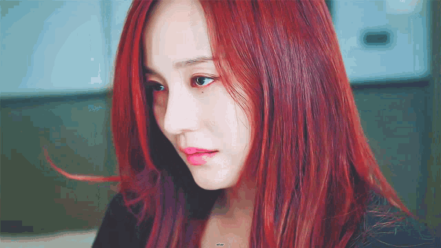 a close up of a woman 's face with red hair and a watermark that says ' star ' on it