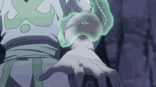 a close up of a person 's hand with a green liquid on it .