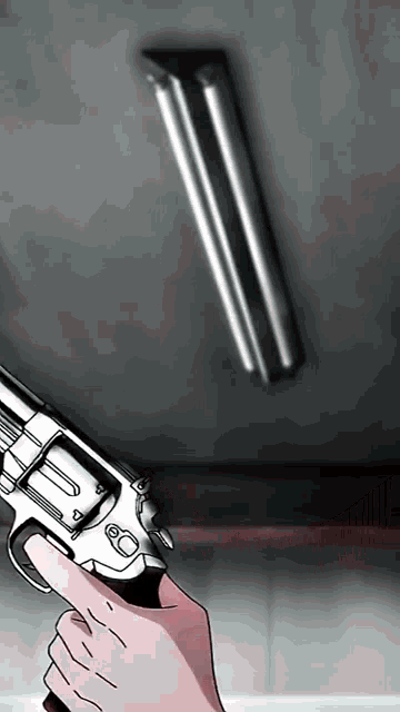 a hand is holding a gun with the number 60 on the barrel