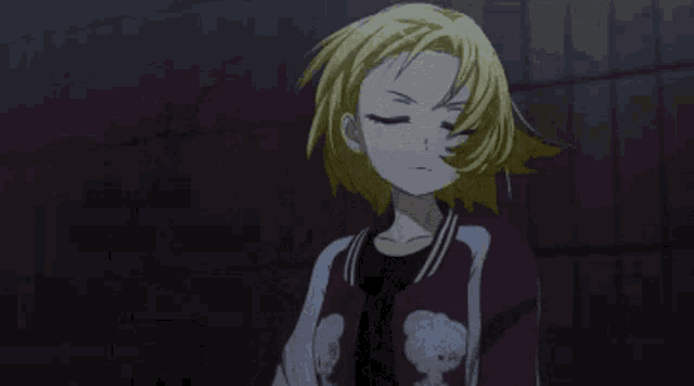 a girl with blonde hair is wearing a red jacket with a bear on it