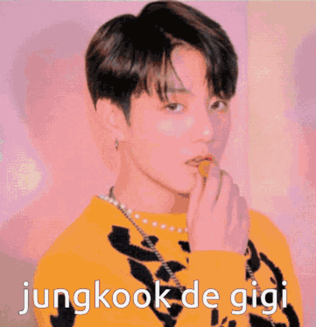 a close up of a person 's face with the words jungkook de gigi