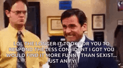a man in a suit and tie is talking to another man in a yellow shirt in an office .
