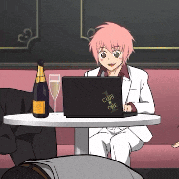 a girl with pink hair is sitting at a table with a laptop that says club one on it