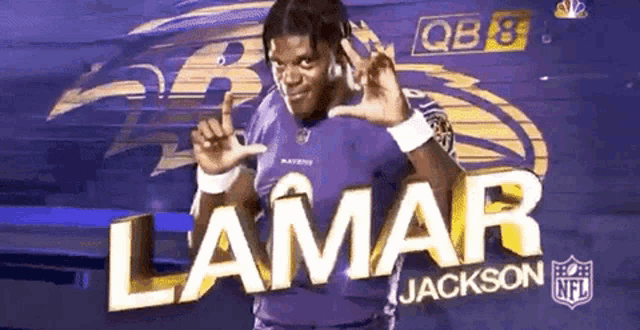 a man in a purple jersey with the name lamar jackson on the front