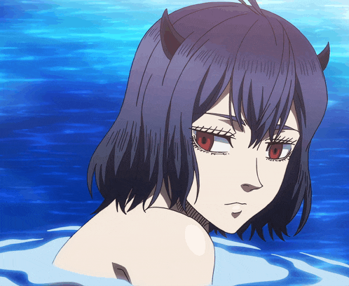 a girl with horns and red eyes is swimming in the water