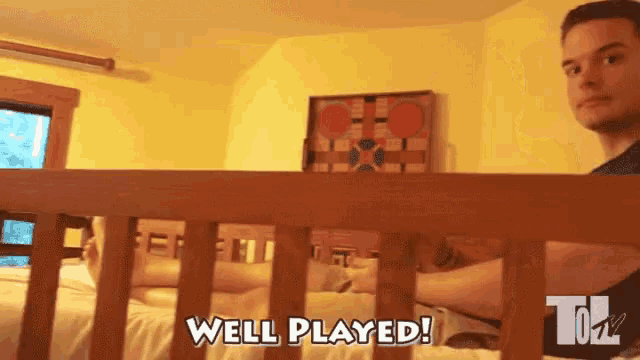 a man laying in a crib with the words well played written on the bottom