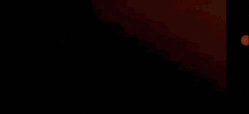 a pixel art drawing of a sunset with a silhouette of a person