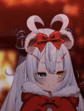 a cartoon character with horns and a red bow