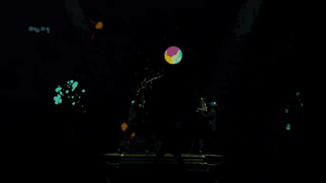 a person is standing in front of a screen with colorful paint splashes