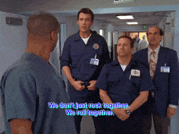a group of men standing in a hallway with the words we don t just rock together we roll together